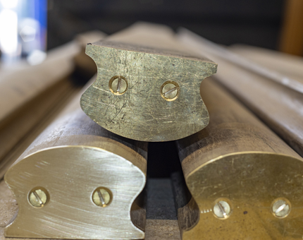A close-up of the brass ends for the handrails.