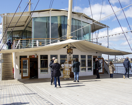 The Verandah Deck outside the Sun Lounge on a sunny day. 