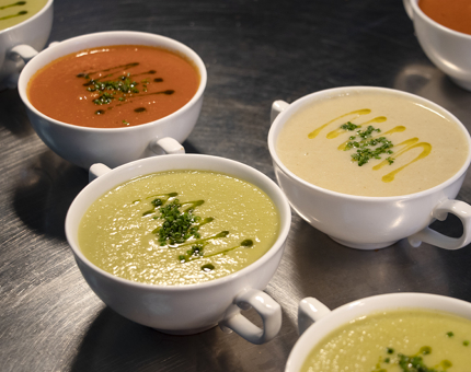 Bowls of different flavoured soup in the Galley. 