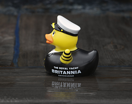 A novelty Admiral rubber deck sitting on a wet deck. 