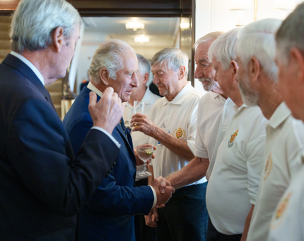 HM The King shaking the hand of a Yottie.