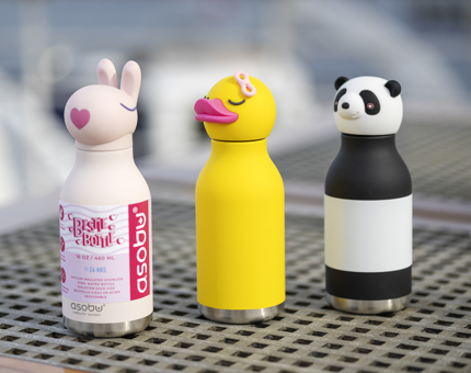 3 kids water bottles, a white one with a rabbit shaped lid, a yellow with a duck lid and a black and white one with a panda lid. 