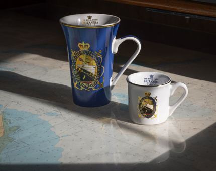 An espresso cup and mug with an image of Britannia on them. 