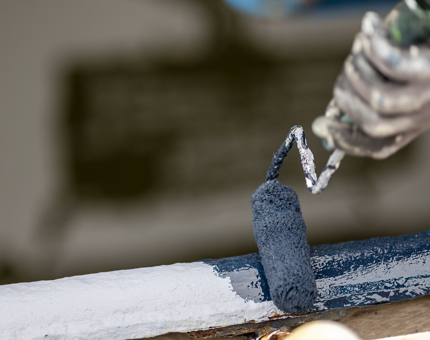 A roller is painting. 