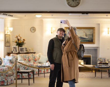 A couple taking a selfie in the State Drawing Room. 