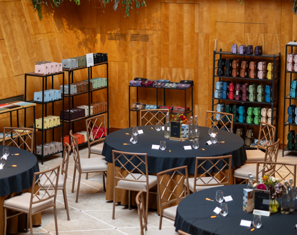 The Ballroom aboard Fingal Hotel in the Port of Leith is set up with round tables to host a bag making event for Islander and Harris Gin. 