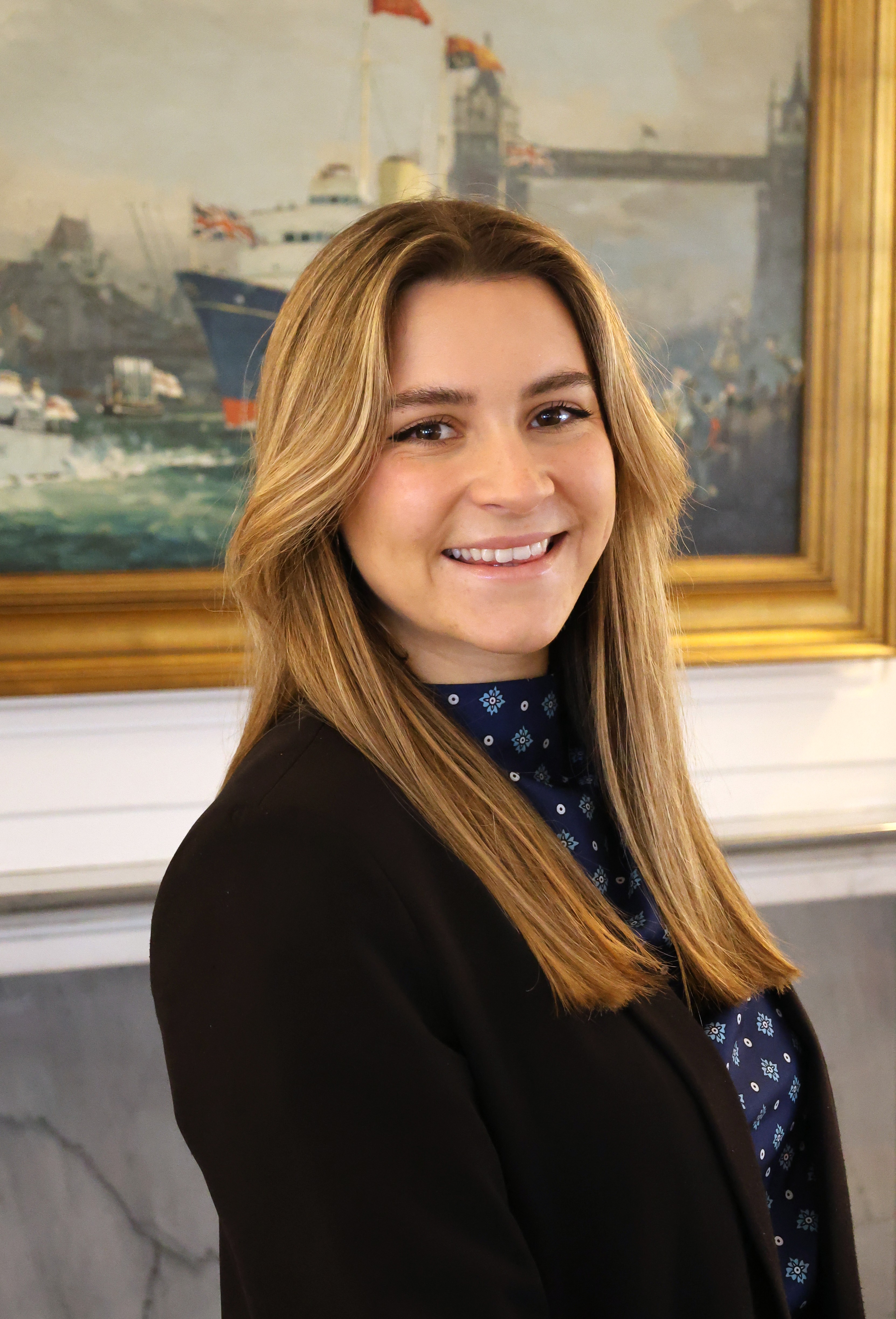 Woman in black suit.