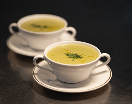 Two bowls of leek and potato soup.